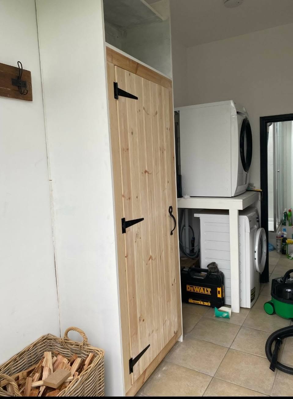 Timber interior door with black hinges and handle