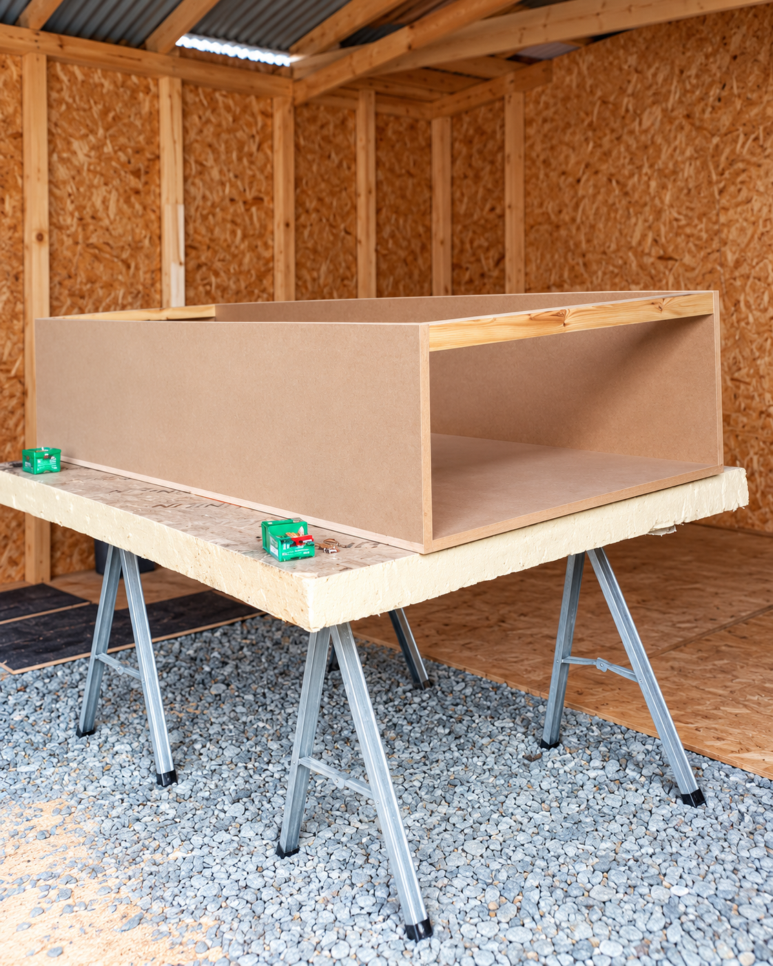 Shelving unit being built on trestles in a workshop